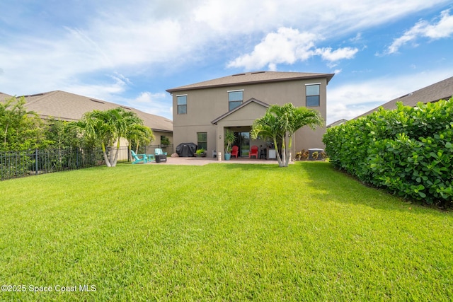739 Fiddleleaf Cir, Melbourne, FL 32904 - rear view of house featuring stucco siding and a patio area