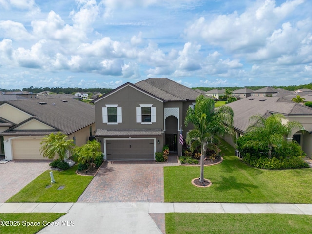 739 Fiddleleaf Cir, Melbourne, FL 32904 - traditional-style home featuring stucco siding, decorative driveway, a front lawn, a residential view, and a garage
