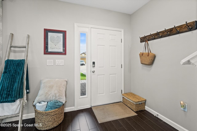 739 Fiddleleaf Cir, Melbourne, FL 32904 - foyer entrance with dark wood-style flooring