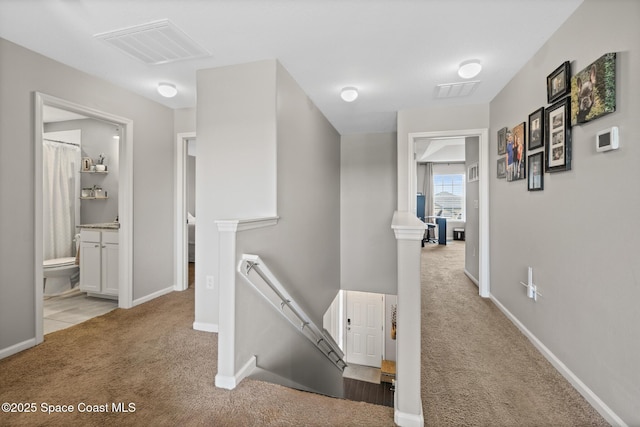 739 Fiddleleaf Cir, Melbourne, FL 32904 - hall with an upstairs landing and carpet flooring