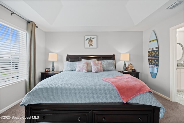 739 Fiddleleaf Cir, Melbourne, FL 32904 - bedroom with carpet, a raised ceiling, and ensuite bathroom