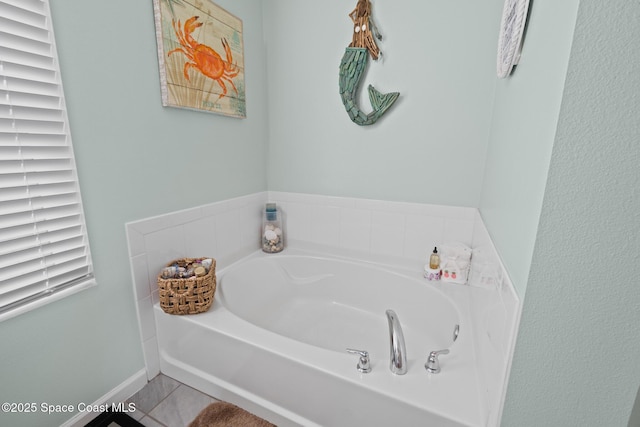 739 Fiddleleaf Cir, Melbourne, FL 32904 - full bathroom with a garden tub and tile patterned floors
