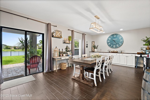 739 Fiddleleaf Cir, Melbourne, FL 32904 - dining area with dark wood finished floors and recessed lighting