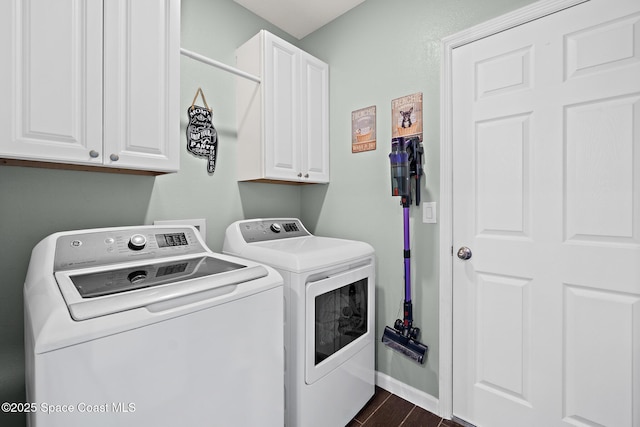 739 Fiddleleaf Cir, Melbourne, FL 32904 - laundry area featuring independent washer and dryer, cabinet space, and dark wood-style flooring