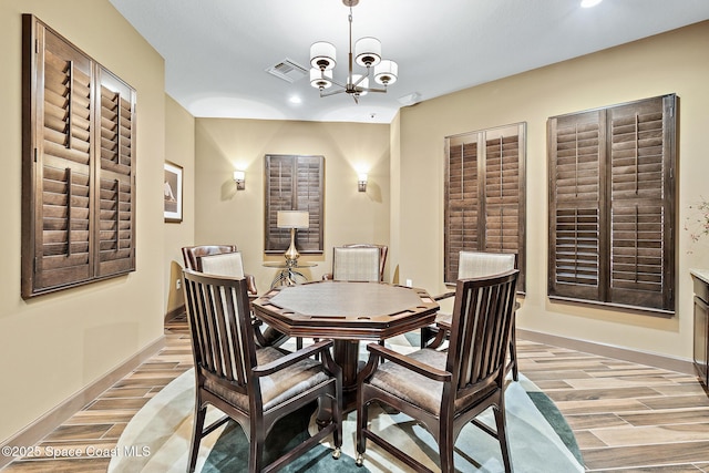 739 Fiddleleaf Cir, Melbourne, FL 32904 - dining area with light wood-style floors, a chandelier, and recessed lighting
