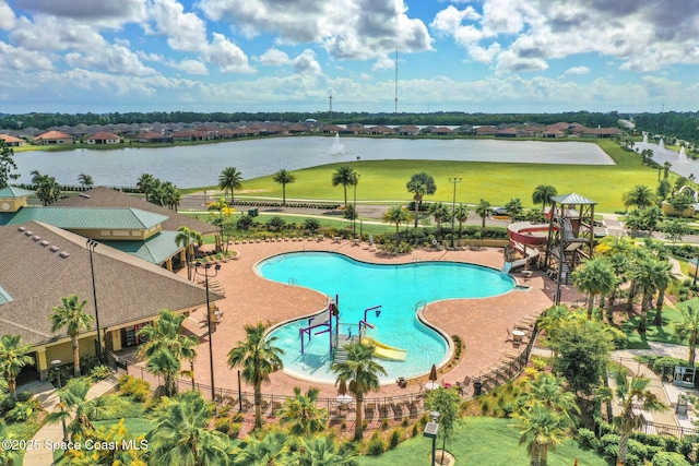 739 Fiddleleaf Cir, Melbourne, FL 32904 - community pool featuring a water slide and a water view