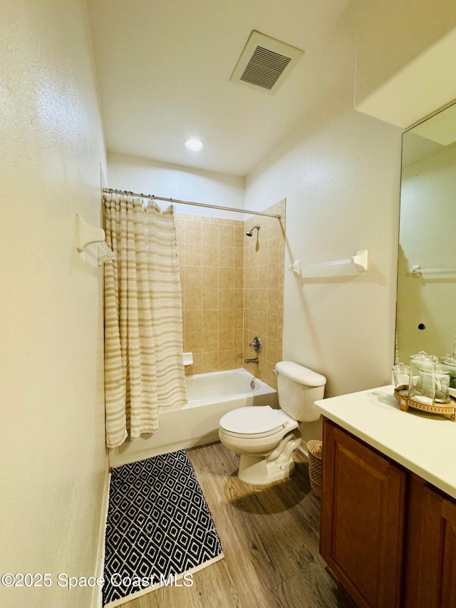 524 Mcguire Blvd, Indian Harbour Beach, FL 32937 - full bathroom featuring vanity, wood finished floors, and shower / bath combo with shower curtain