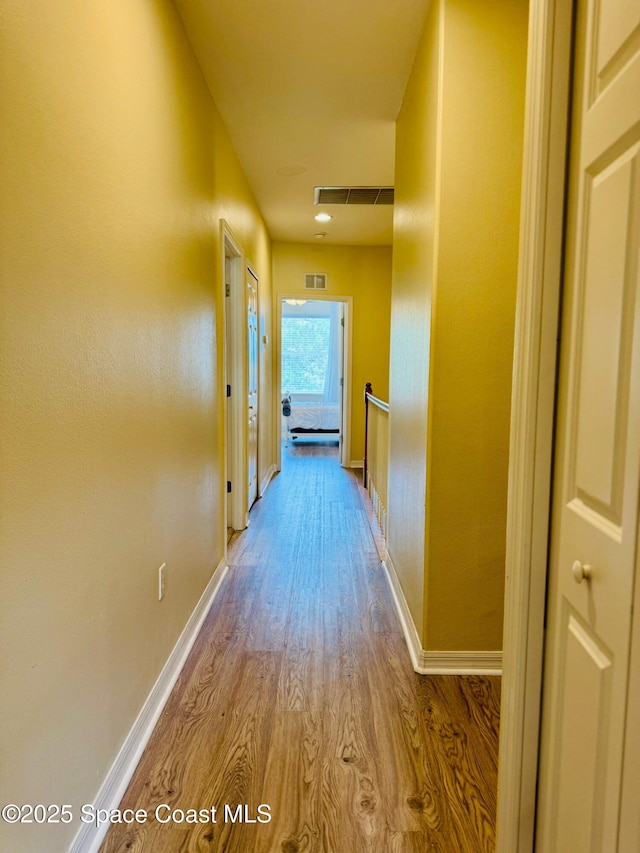 524 Mcguire Blvd, Indian Harbour Beach, FL 32937 - hallway featuring wood finished floors and baseboards