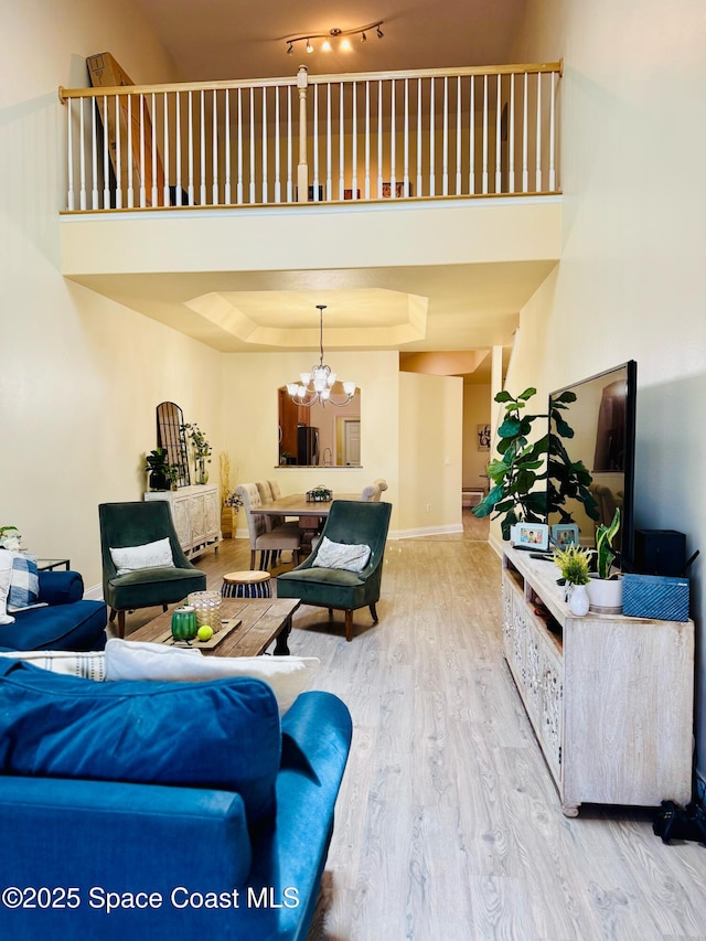 524 Mcguire Blvd, Indian Harbour Beach, FL 32937 - living room with wood finished floors and a chandelier
