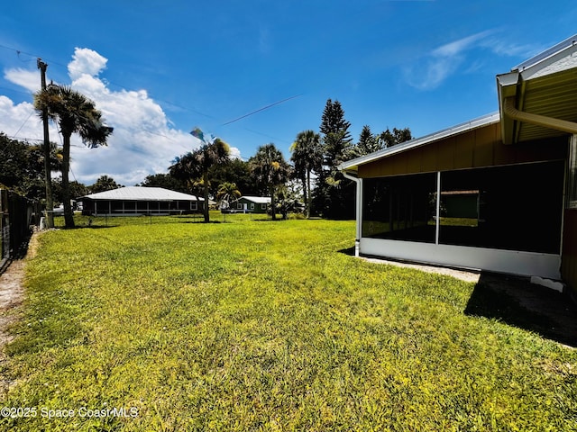 658 Ervin St, Sebastian, FL 32958 - view of yard with a sunroom