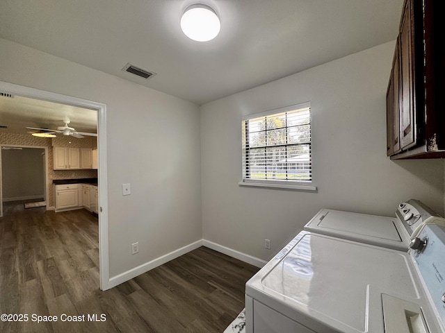 658 Ervin St, Sebastian, FL 32958 - laundry room featuring washing machine and clothes dryer, cabinet space, dark wood-style floors, and a ceiling fan