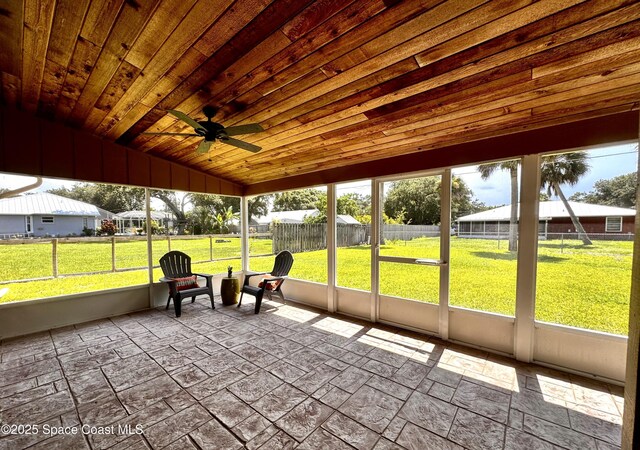 658 Ervin St, Sebastian, FL 32958 - sunroom featuring a ceiling fan, vaulted ceiling, and plenty of natural light