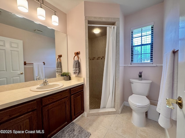 658 Ervin St, Sebastian, FL 32958 - bathroom featuring vanity, tile patterned floors, and a tile shower