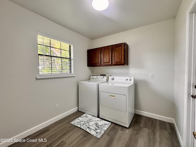 658 Ervin St, Sebastian, FL 32958 - laundry area with washer and dryer, cabinet space, and dark wood-type flooring