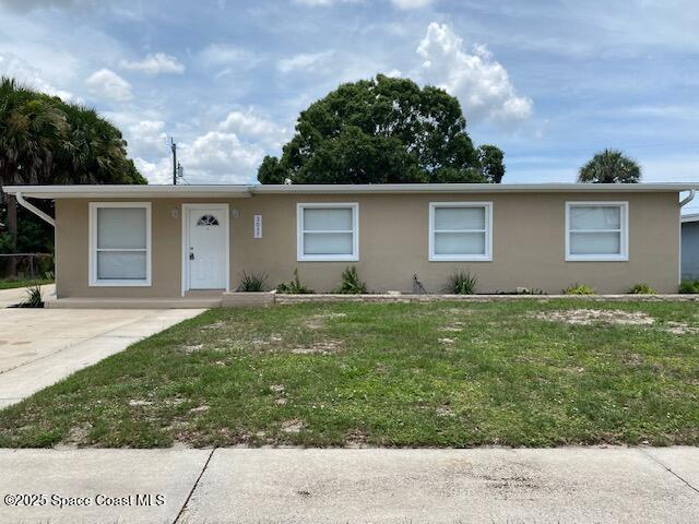 3037 Rowe St NE, Palm Bay, FL 32905 - ranch-style home featuring stucco siding and a front yard