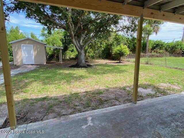 3037 Rowe St NE, Palm Bay, FL 32905 - view of grassy yard with a storage shed