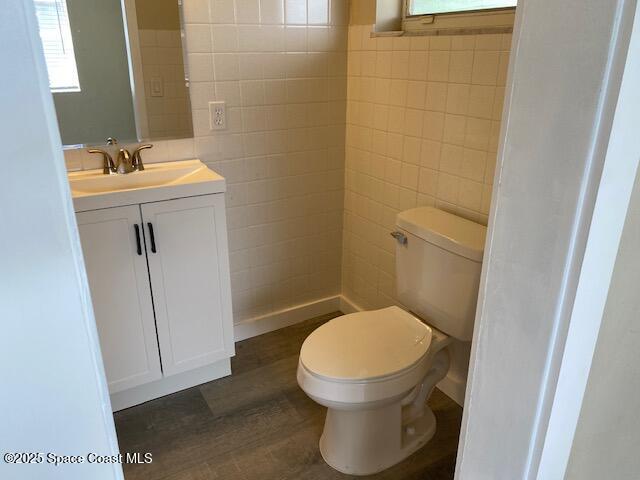3037 Rowe St NE, Palm Bay, FL 32905 - bathroom with vanity and tile walls