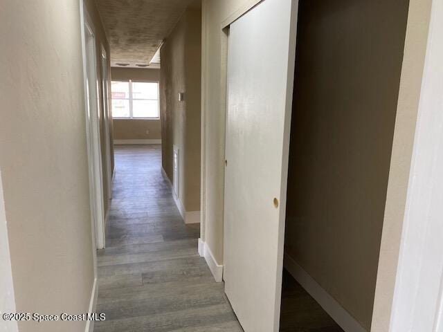 3037 Rowe St NE, Palm Bay, FL 32905 - hall featuring baseboards and wood finished floors