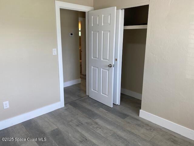 3037 Rowe St NE, Palm Bay, FL 32905 - unfurnished bedroom featuring wood finished floors and a closet