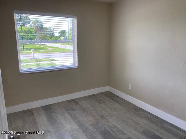 3037 Rowe St NE, Palm Bay, FL 32905 - unfurnished room featuring wood finished floors