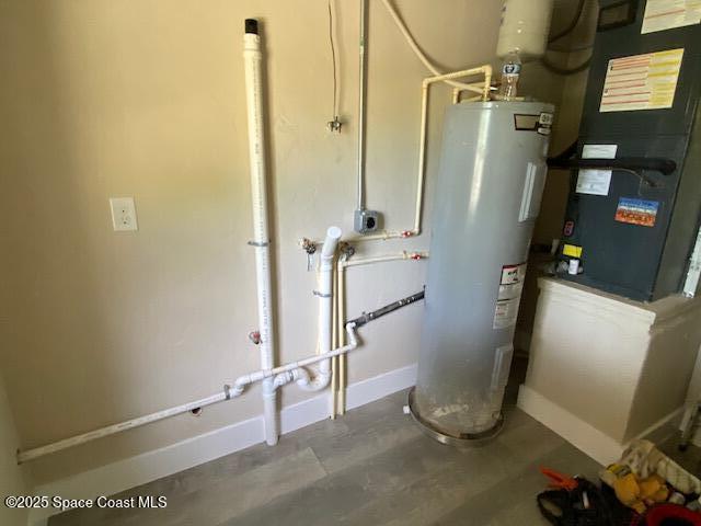 3037 Rowe St NE, Palm Bay, FL 32905 - utility room featuring electric water heater and heating unit