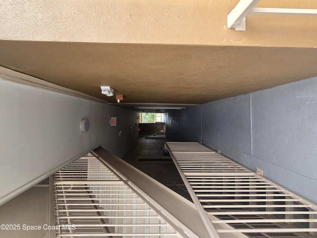 6470 Borasco Dr Unit 2102, Melbourne, FL 32940 - staircase featuring a textured ceiling