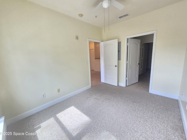 6470 Borasco Dr Unit 2102, Melbourne, FL 32940 - unfurnished bedroom with light carpet and a ceiling fan