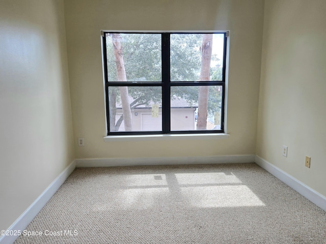 6470 Borasco Dr Unit 2102, Melbourne, FL 32940 - empty room with carpet flooring and baseboards