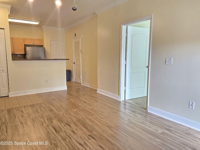 6470 Borasco Dr Unit 2102, Melbourne, FL 32940 - unfurnished living room featuring light wood-style floors and ornamental molding