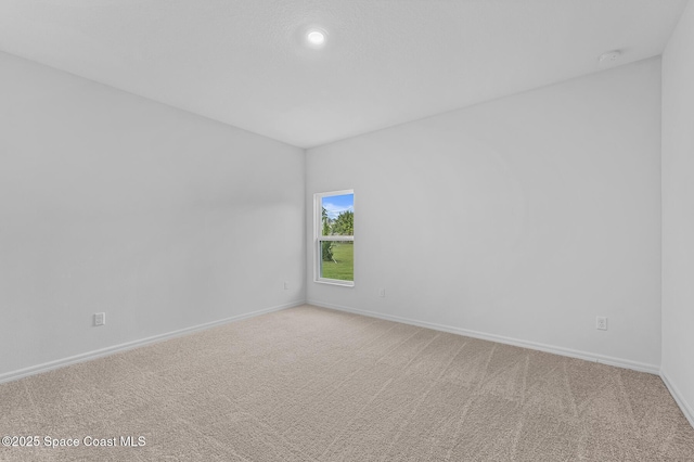 2206 Hialeah St, Palm Bay, FL 32907 - spare room featuring a smoke detector, light carpet, and recessed lighting