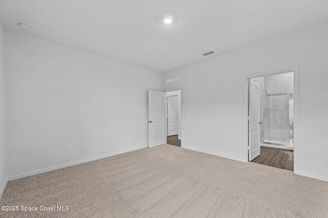 2206 Hialeah St, Palm Bay, FL 32907 - unfurnished bedroom featuring dark carpet and recessed lighting