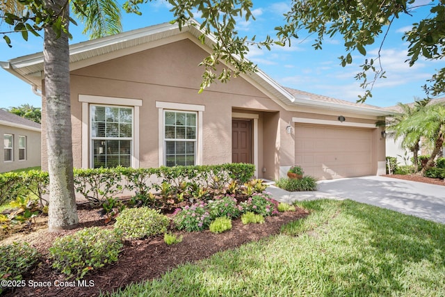 103 Amherst Ln, Sebastian, FL 32958 - single story home with stucco siding, driveway, an attached garage, and a front yard