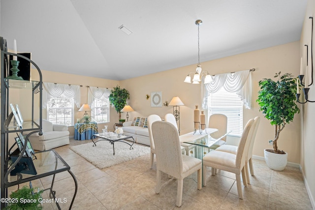 103 Amherst Ln, Sebastian, FL 32958 - dining room with lofted ceiling, a chandelier, and light tile patterned floors