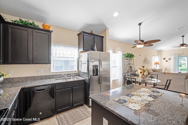 103 Amherst Ln, Sebastian, FL 32958 - kitchen featuring black dishwasher, stainless steel fridge, a ceiling fan, open floor plan, and dark stone countertops