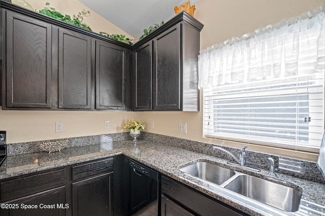 103 Amherst Ln, Sebastian, FL 32958 - kitchen featuring black dishwasher, vaulted ceiling, and dark stone countertops