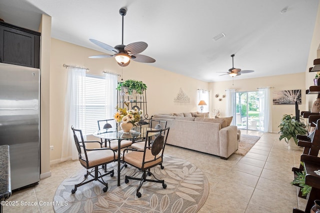 103 Amherst Ln, Sebastian, FL 32958 - dining room with a ceiling fan, lofted ceiling, and light tile patterned floors