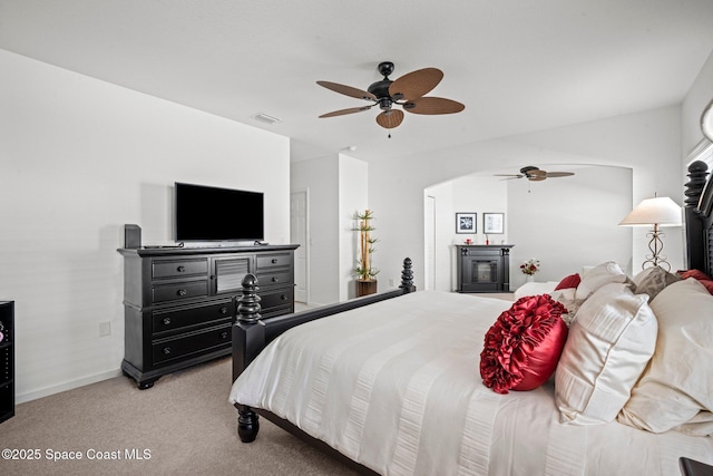 103 Amherst Ln, Sebastian, FL 32958 - bedroom featuring arched walkways, light colored carpet, and a ceiling fan