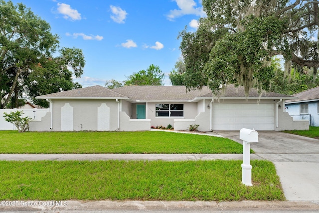 1119 Manatee Dr, Rockledge, FL 32955 - ranch-style house with concrete driveway, a garage, a front lawn, a shingled roof, and stucco siding