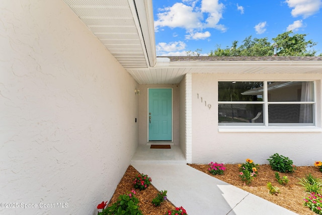 1119 Manatee Dr, Rockledge, FL 32955 - view of exterior entry featuring stucco siding