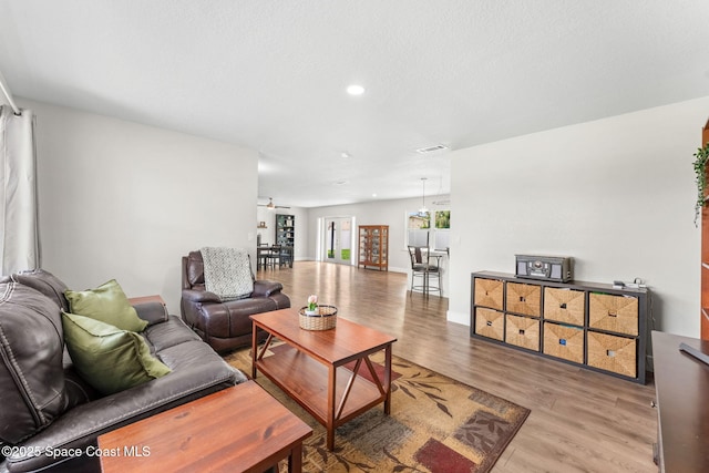 1119 Manatee Dr, Rockledge, FL 32955 - living area featuring wood finished floors, recessed lighting, and a ceiling fan