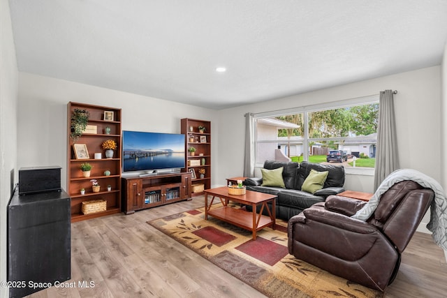 1119 Manatee Dr, Rockledge, FL 32955 - living area featuring light wood-style floors and recessed lighting