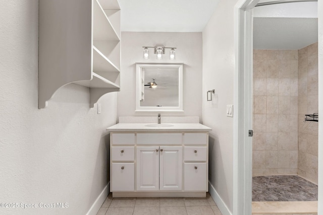 1119 Manatee Dr, Rockledge, FL 32955 - bathroom featuring vanity, tile patterned floors, a ceiling fan, and a tile shower