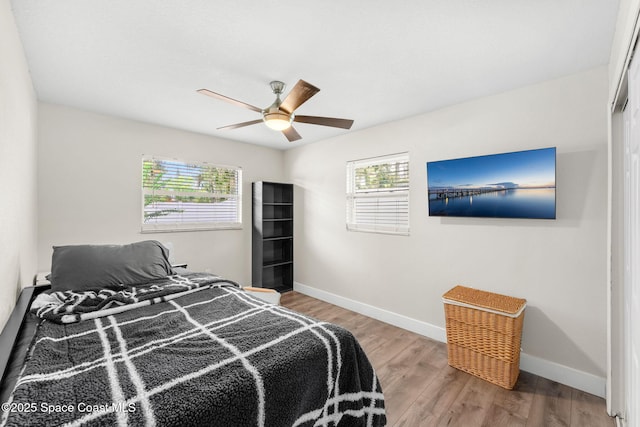 1119 Manatee Dr, Rockledge, FL 32955 - bedroom with wood finished floors and ceiling fan