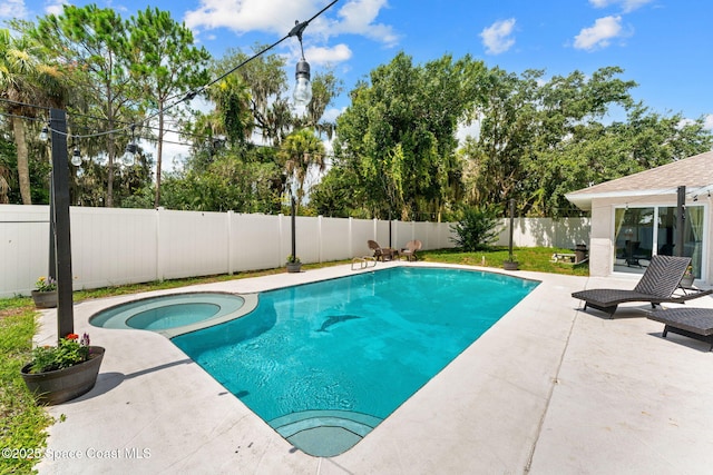 1119 Manatee Dr, Rockledge, FL 32955 - view of pool featuring a patio area, a fenced backyard, and a pool with connected hot tub