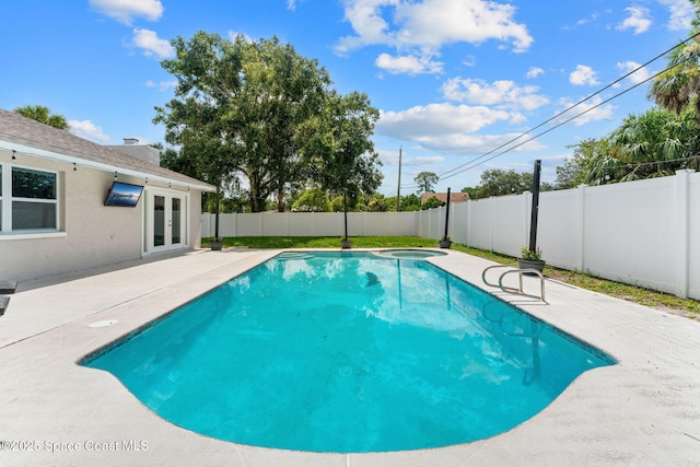 1119 Manatee Dr, Rockledge, FL 32955 - view of pool featuring french doors, a fenced backyard, a patio area, and a pool with connected hot tub