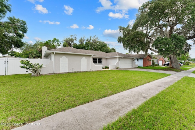 1119 Manatee Dr, Rockledge, FL 32955 - ranch-style home featuring a garage, concrete driveway, and a chimney