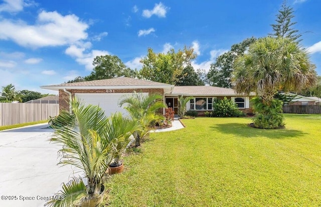 631 Dundee Cir, Melbourne, FL 32904 - view of front facade with concrete driveway, an attached garage, and brick siding