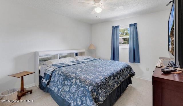 631 Dundee Cir, Melbourne, FL 32904 - bedroom featuring light tile patterned floors, a textured ceiling, and ceiling fan