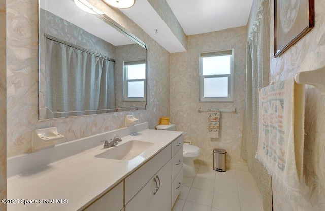 631 Dundee Cir, Melbourne, FL 32904 - full bathroom featuring tile patterned flooring, healthy amount of natural light, vanity, and wallpapered walls
