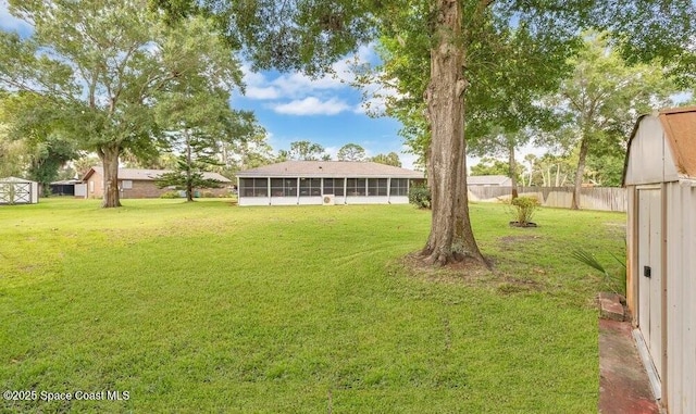 631 Dundee Cir, Melbourne, FL 32904 - view of yard with a sunroom and a shed